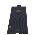 Black rubber mat with a brand logo on a white background