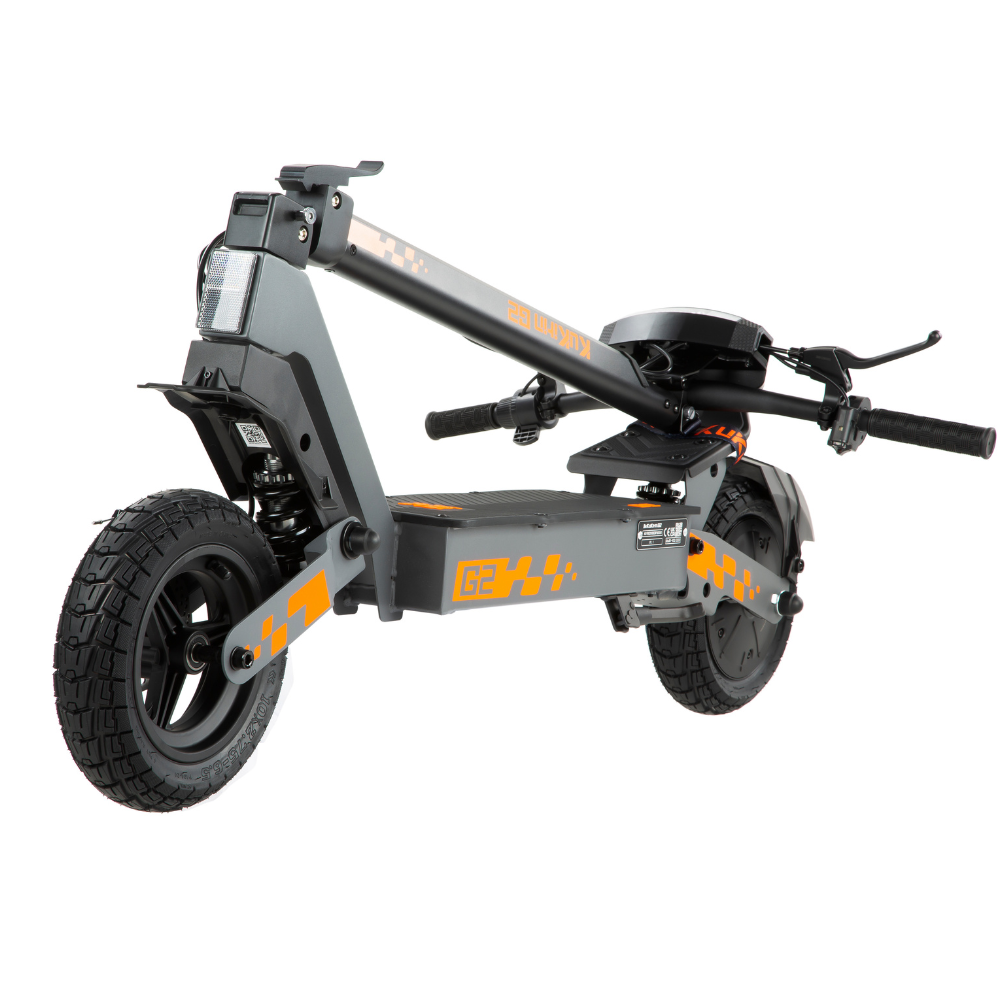 Folded KuKirin G2 electric scooter for easy storage.