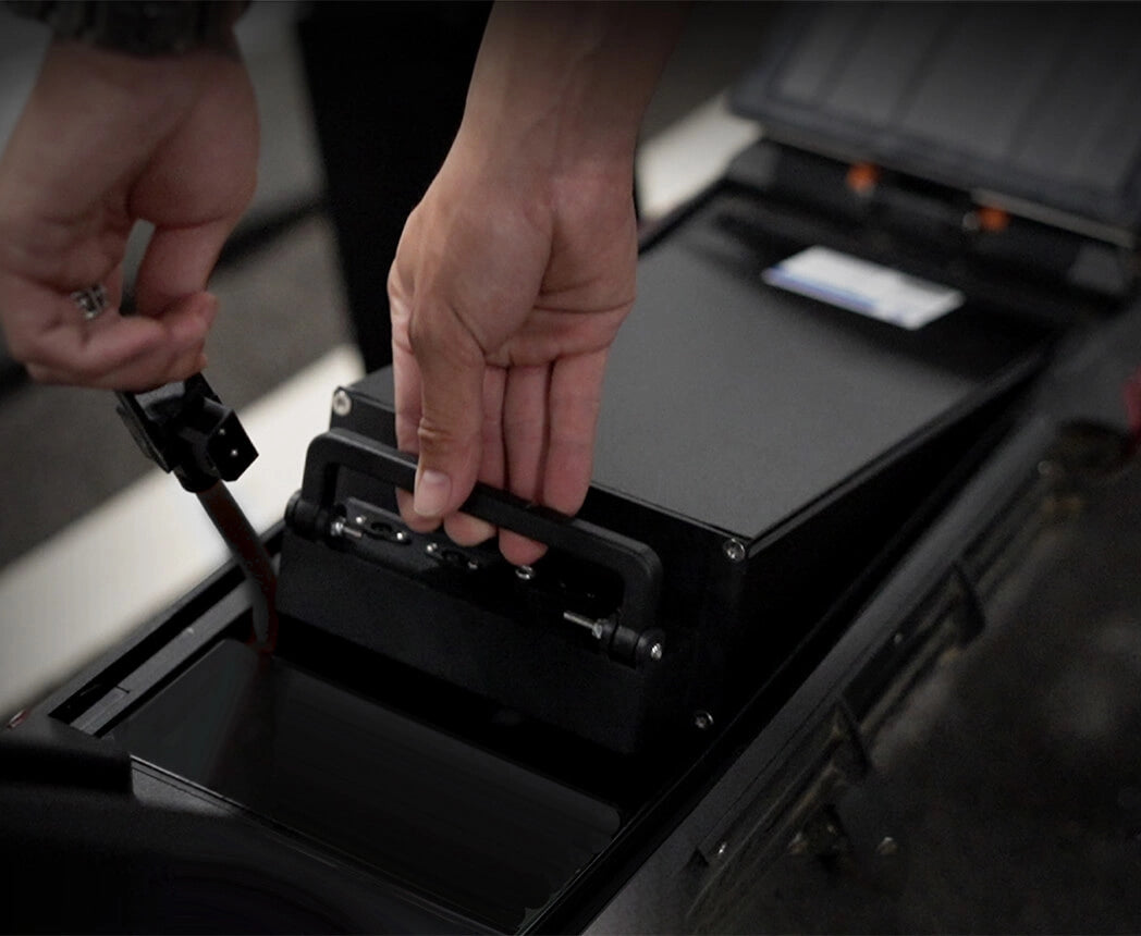 Lifting the high-capacity 52V 18Ah removable lithium battery out of the KuKirin G3 Pro.