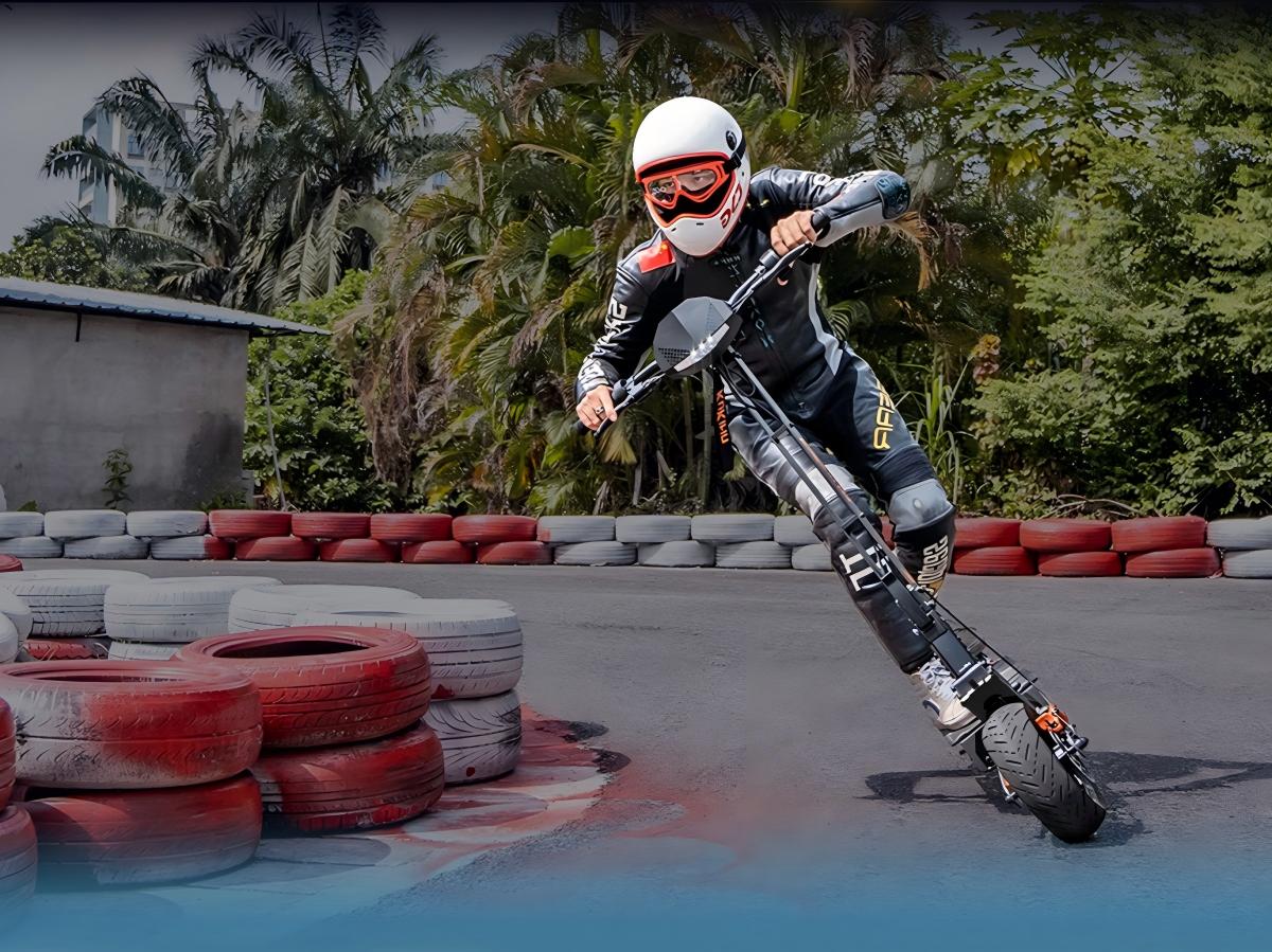Professional rider leaning a KuKirin G4 into a high-speed turn on a racetrack.